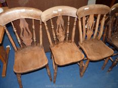 Three kitchen chairs with lyre style splats.