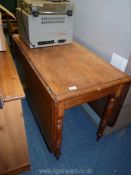 A drop leaf table, 41" w extends to 60" long.