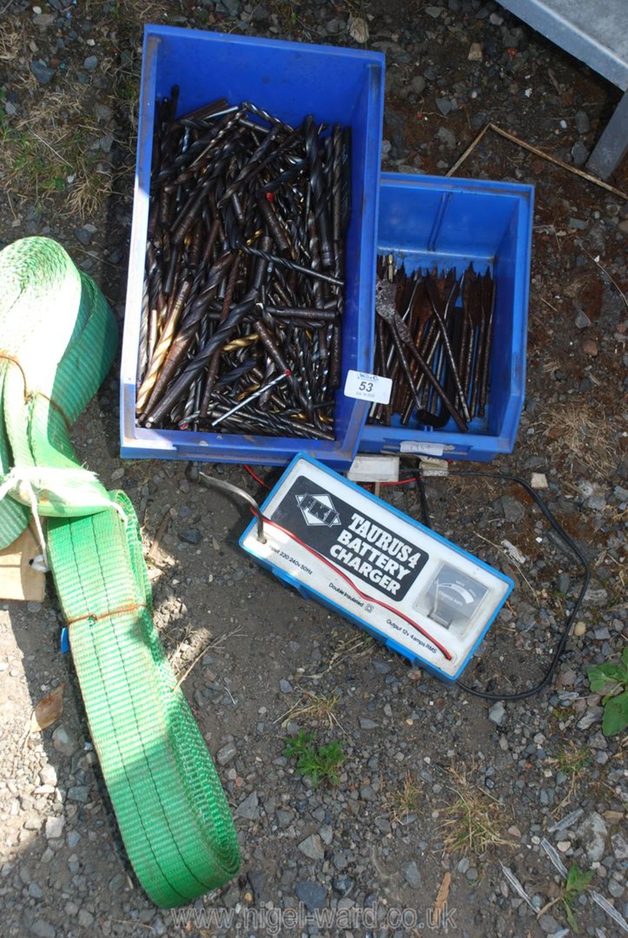 Battery charger, roof straps, two large bin lids, drill bits etc.