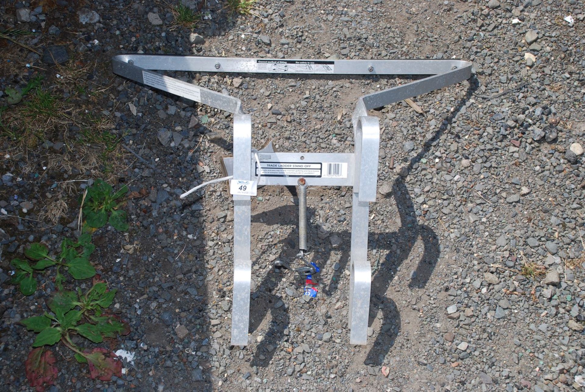 A metal ladder stand off
