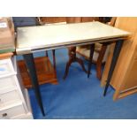 Hall table with cream top under glass.