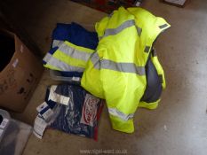 A box of protective flame resistant overalls size L, high vis coat etc.