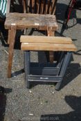 A rustic workbench and a pair of metal trestles.