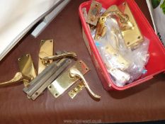 Box of brass door handles, bolts etc.