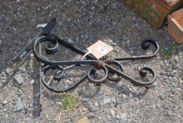 A pair of heavy duty ornate garden brackets.