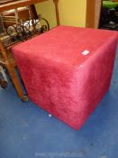 Red upholstered cube footstool 29".