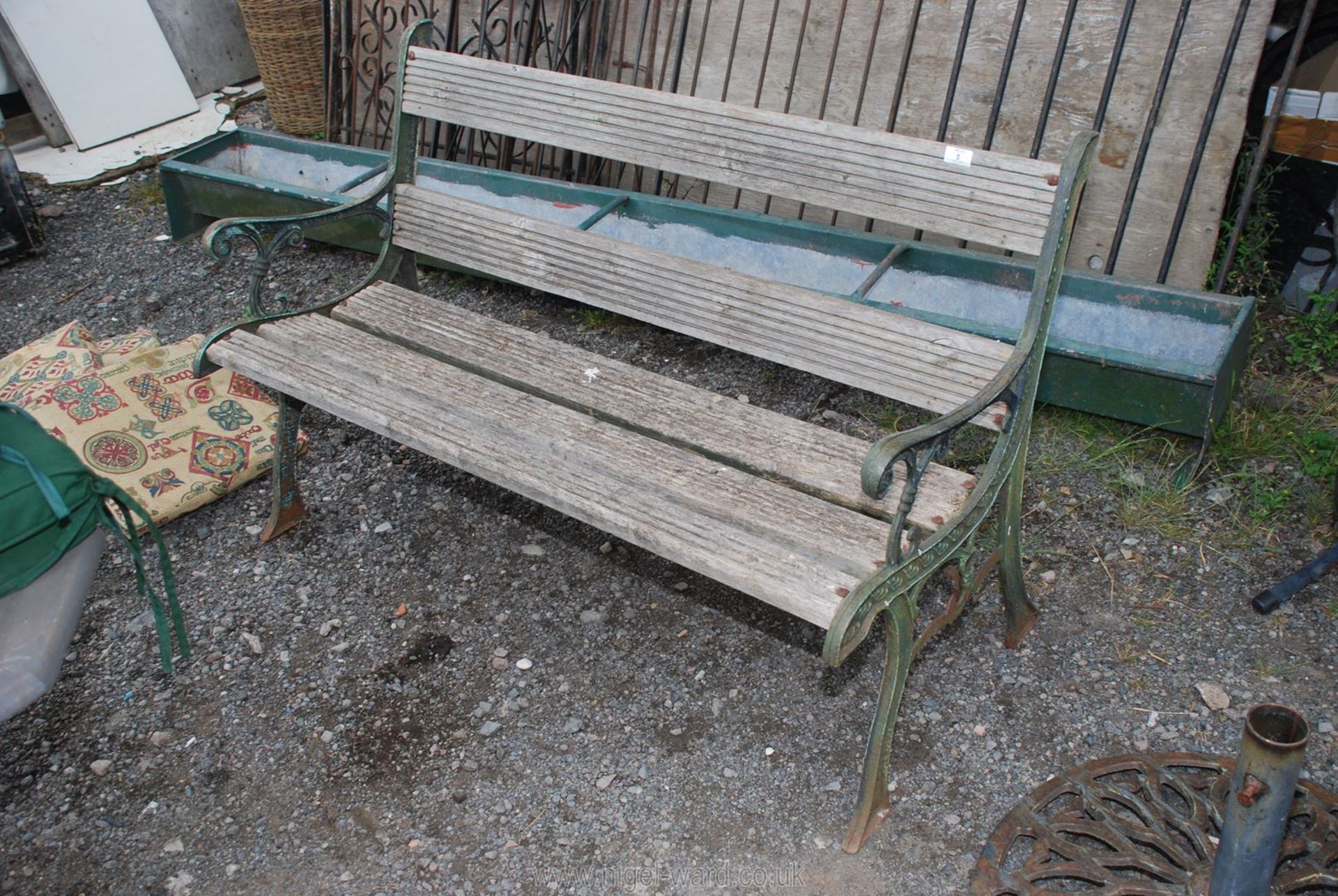 A garden bench with cast iron ends.