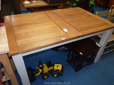 Extending dining table on grey base and legs 55" wide (before ext.) x 36" deep x 31" high.
