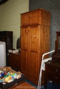 A pine wardrobe with upper storage and lower drawer, 32"wide x 86" high x 20" deep.