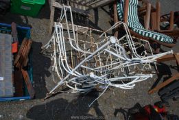 Two garden chairs and table in need of restoration.