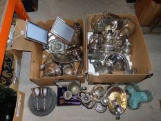 Two boxes of silver plate including teapots, candlestick, picture frames,