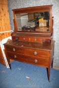 A mahogany two over one dressing table on tapering square legs with castors,