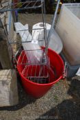 Red bin with chrome bathroom rack etc.