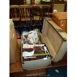 A vintage suitcase and contents including; Canon word processor, Top Gear game, singles, etc.