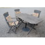 A wooden 'Classic' garden table and 3 chairs with cushions and umbrella stand.