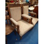 Pair of show frame hall chairs with beige upholstered seats and arm pads.