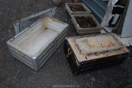 2 metal military trunks.