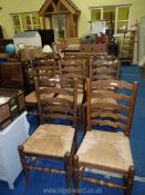 A set of 8 seagrass seated ladder back dining chairs.