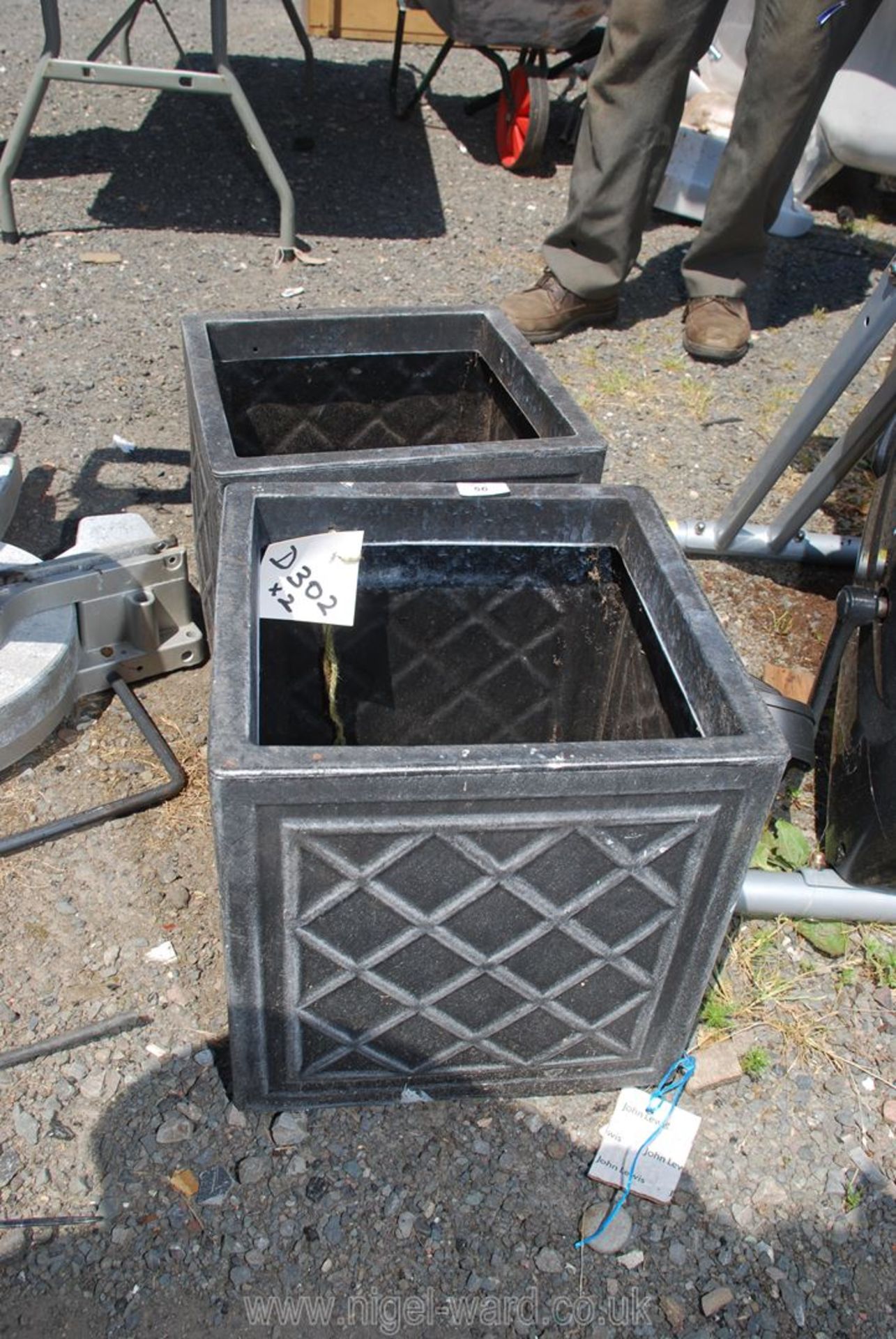A pair of moulded plastic planters,