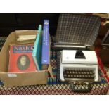 Lilliput manual typewriter and box of books.