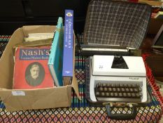 Lilliput manual typewriter and box of books.