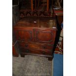 A circa 1800 Mahogany Commode having two false drawers to the front,