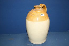 A large shapely pottery wine/spirits flask labelled to Richard Bennett Wines and Brandy Merchant,