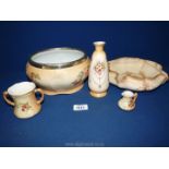 A Royal Worcester blush ivory two handled cup (reg no. G1058) and miniature jug (reg no.