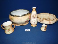 A Royal Worcester blush ivory two handled cup (reg no. G1058) and miniature jug (reg no.