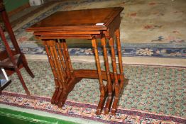 A modern Bright's of Nettlebed Mahogany and cross banded nest of three Tables in traditional design.