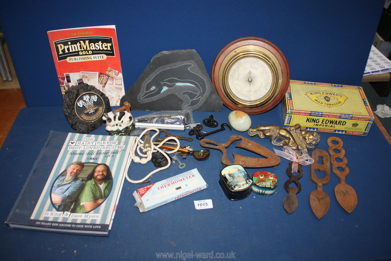 A quantity of miscellanea including a barometer, Welsh stone, cherub wall hanging, whistle,