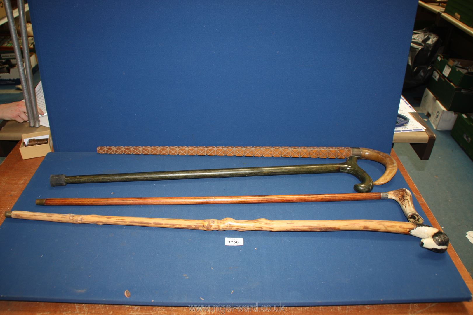 A quantity of walking sticks to include one with ram horn handle,