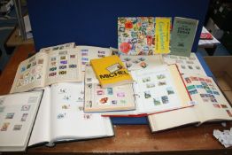 A quantity of Stamp Albums with foreign and English stamps,