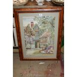 A framed embroidery of old country houses, trees and flowers, 25'' x 32'' overall.