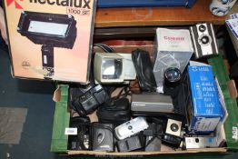 A box of cameras including a boxed Flectalux 10000 SE halogen lamp, boxed Polaroid instant camera,