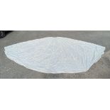 A white Nylon Parachute, 24ft approx with repairs and tears.