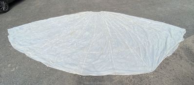 A white Nylon Parachute, 24ft approx with repairs and tears.