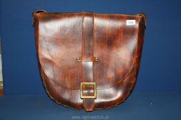 A large leather Saddlebag with brass buckle and fittings, 20" wide.