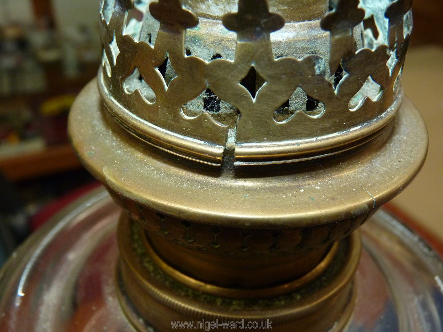 An Oil lamp on square brass bass, marbled effect stand, clear glass reservoir, no shade or chimney, - Image 12 of 12