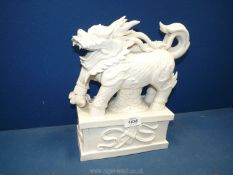 A Dehue blanc de chine Fo dog with exceptionally elaborate mane, probably Quianlong period,