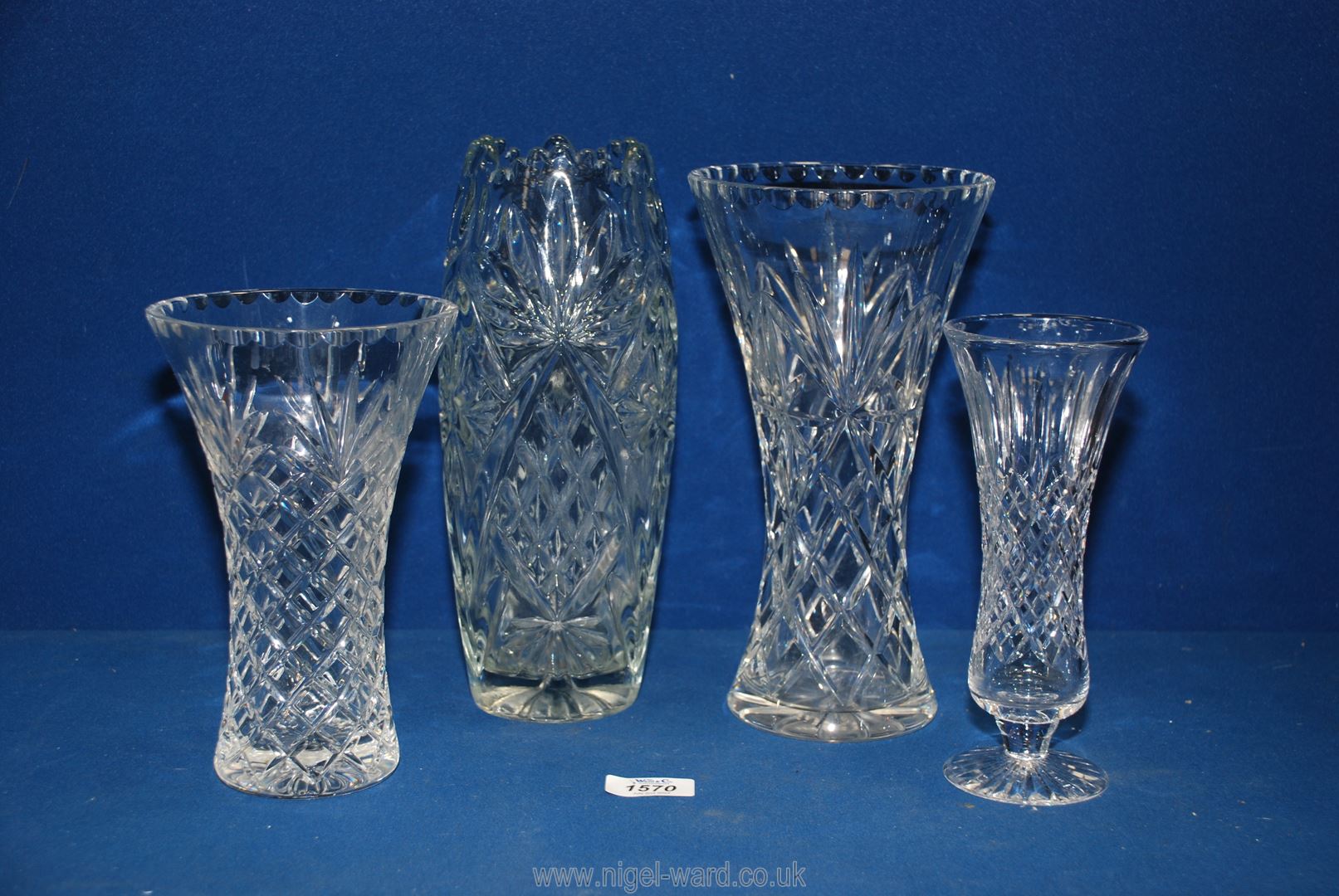 Four glass vases including footed, cut detail etc, largest 10'' tall.