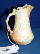 A circa 1900 Worcester Locke & Co jug in pale blush with raised decoration of oak leaves and acorns,