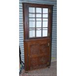 A 19th c. Oak full height Corner Cabinet on Cupboard