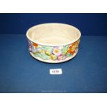 A Clarice Cliff bowl with colourful floral decoration.