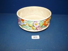 A Clarice Cliff bowl with colourful floral decoration.