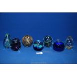 A quantity of paperweights mostly in blues to include Adrian Sankey cream and brown feather effect