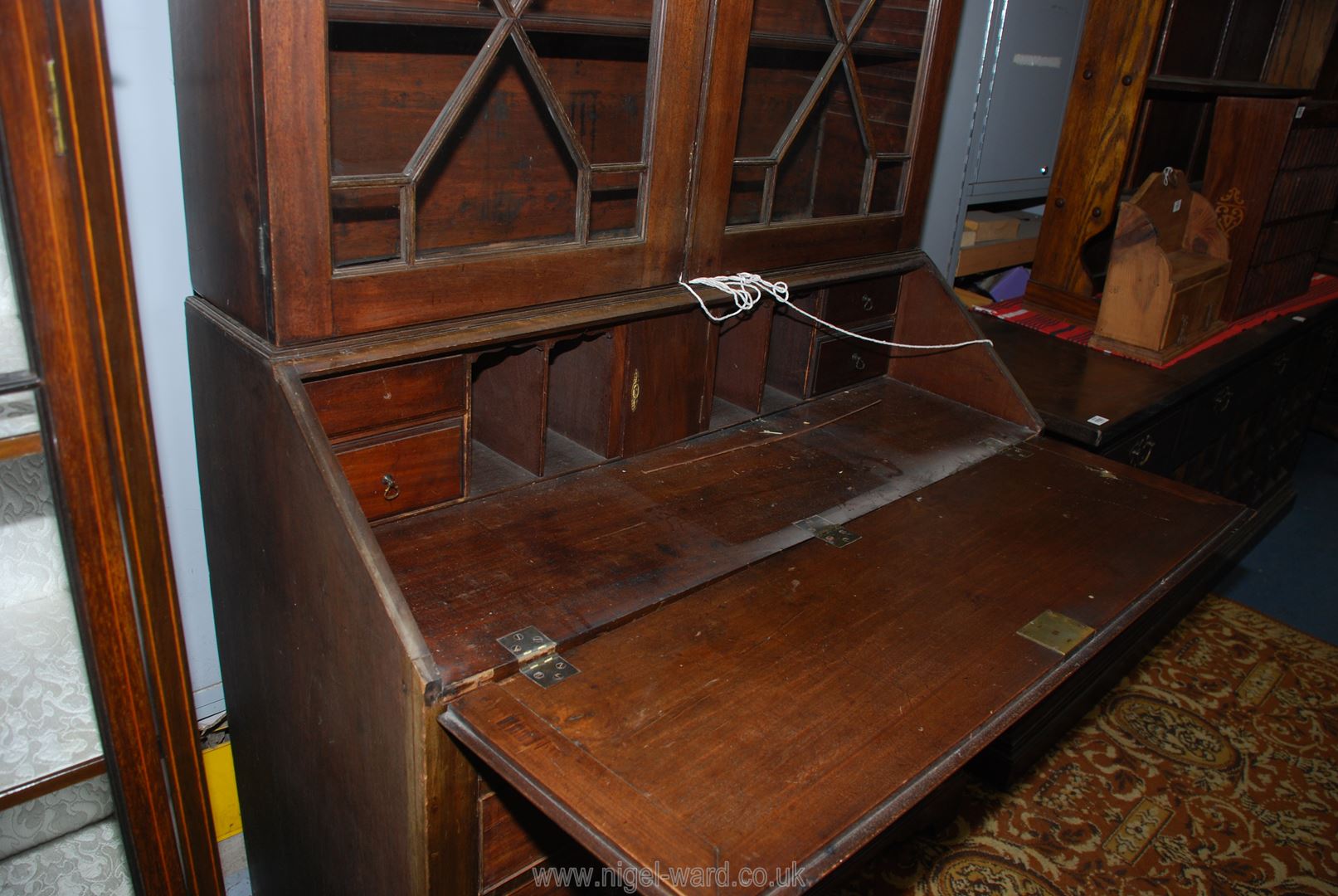 A circa 1900 Mahogany Bureau Bookcase having a pair of opposing 13 pane geometrically glazed doors - Image 4 of 4