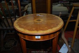 A mixed woods circular occasional table having inlaid parquetry top in contrasting colours and with