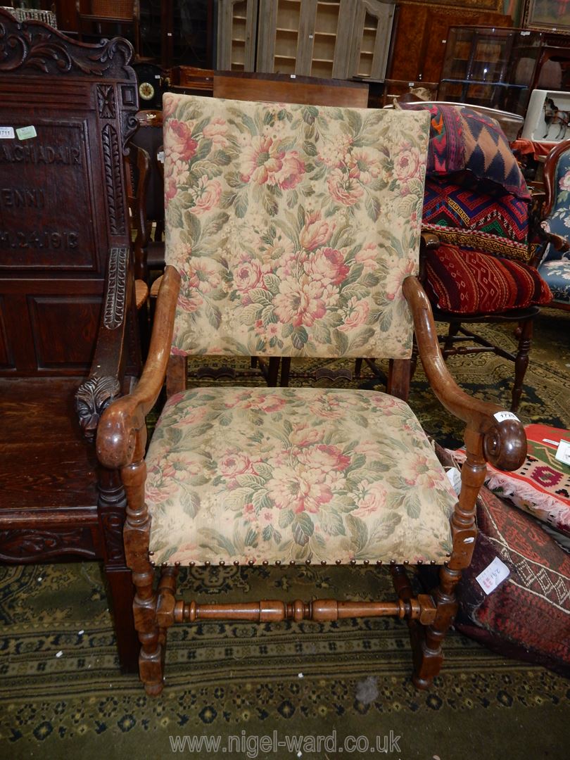 An elegant open armed Armchair having attractive scroll terminating arms,