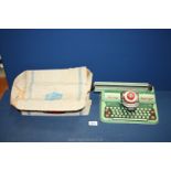 A 1950's Mettoy Supertype toy typewriter in green with original box (box a/f) 10" wide.